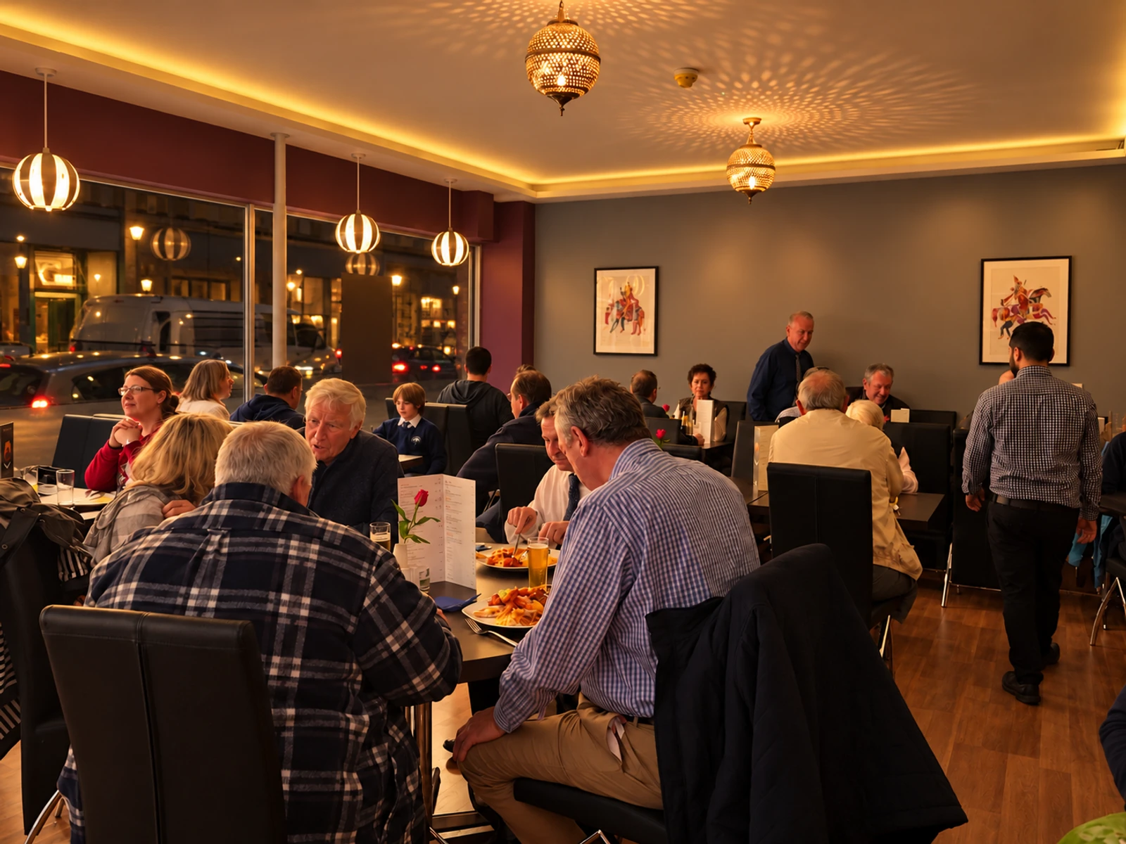 Guests enjoying dinner in the warmly lit restaurant