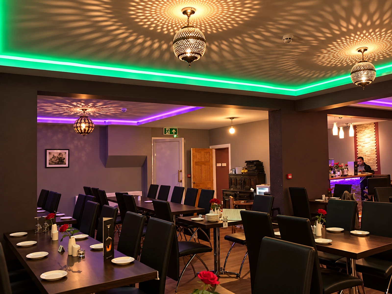 Masala Bay’s dining space with glowing pendants and neatly set tables